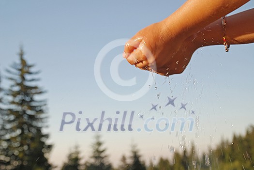 clear water falling on children hands clear water falling on children hands
