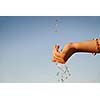 clear water falling on children hands