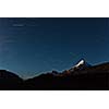 Star trails above Himalayas mountains in night.