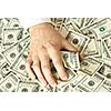 Greedy hand grabs money lot of dollars