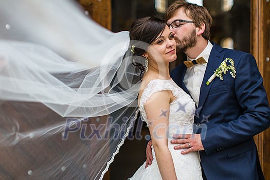 Portrait of a young wedding couple on their wedding day Portrait of a young wedding couple on their wedding day