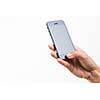 Female hand holding a smart phone, isolated on white