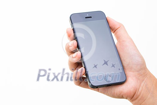 Female hand holding a smart phone, isolated on white Female hand holding a smart phone, isolated on white