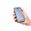 Female hand holding a smart phone, isolated on white