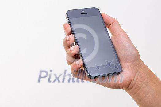 Female hand holding a smart phone, isolated on white Female hand holding a smart phone, isolated on white