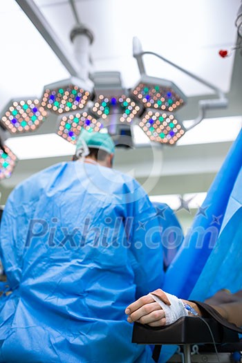 Unidentified boy undergoing a surgery. Focus on the monitor with vital functions Unidentified boy undergoing a surgery. Focus on the monitor with vital functions
