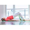 Pretty young woman doing YOGA exercise at home