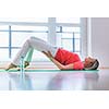 Pretty young woman doing YOGA exercise at home