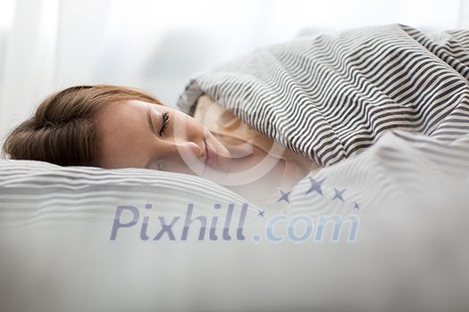 Beautiful young woman sleeping in bed Beautiful young woman sleeping in bed