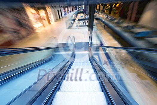 Shopping mall center escalators. Zoom blur movement. Shopping mall center escalators. Zoom blur movement.