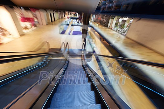 Shopping mall center escalators. Zoom blur movement. Shopping mall center escalators. Zoom blur movement.