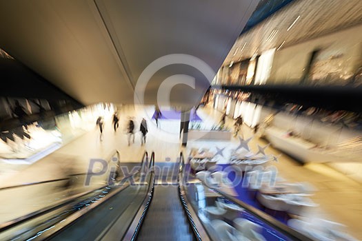 Shopping mall center escalators. Zoom blur movement. Shopping mall center escalators. Zoom blur movement.
