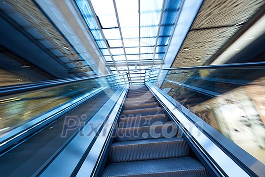 Shopping mall center escalators. Zoom blur movement. Shopping mall center escalators. Zoom blur movement.