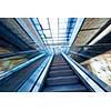 Shopping mall center escalators. Zoom blur movement.