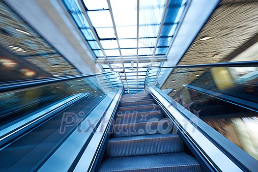 Shopping mall center escalators. Zoom blur movement. Shopping mall center escalators. Zoom blur movement.