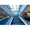 Shopping mall center escalators. Zoom blur movement.