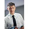 business man using phone at modern office space