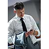 business man using phone at modern office space
