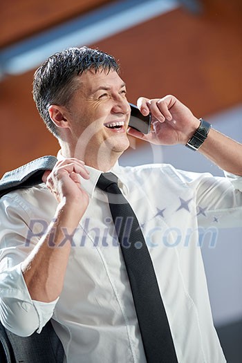 business man using phone at modern office space business man using phone at modern office space