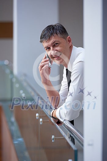 business man using phone at modern office space business man using phone at modern office space