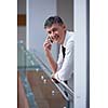 business man using phone at modern office space