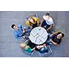 top view,  group of students together  at school table working homework and have fun