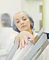 woman worker in pharmacy company warehouse