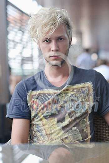 Portrait of an handsome young man with urban background and fashion clothes style Portrait of an handsome young man with urban background and fashion clothes style