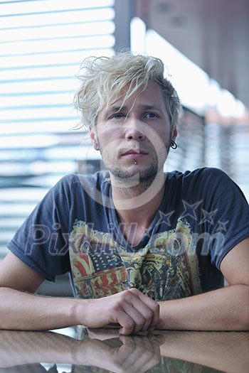 Portrait of an handsome young man with urban background and fashion clothes style Portrait of an handsome young man with urban background and fashion clothes style