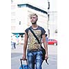 Portrait of an handsome young  man  with urban background and fashion clothes style