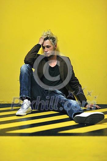 Portrait of an handsome young man with urban background and fashion clothes style Portrait of an handsome young man with urban background and fashion clothes style