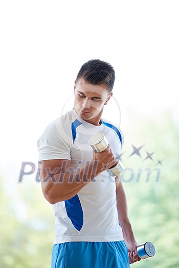 young man in fintess sport club exercise with weights and relaxing young man in fintess sport club exercise with weights and relaxing