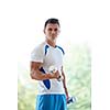 young man in fintess sport club exercise with weights and relaxing