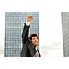 Outdoor portrait of young and happy  businessman