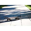 Old used skateboard isolated on the ground on street