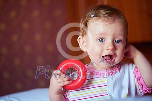 happy baby with first teeth smilling and play with toys happy baby with first teeth smilling and play with toys
