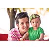 portrait of happy young mother and baby  while have  fun