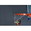 Basketball ball,  board and net  on grey  background in gym indoor