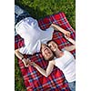 happy young romantic couple in love   having a picnic outdoor on a summer day