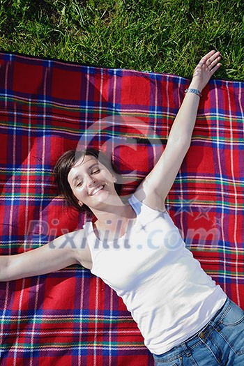 Enjoying the nature and life. Young woman arms raised enjoying the fresh air in green nature Enjoying the nature and life. Young woman arms raised enjoying the fresh air in green nature