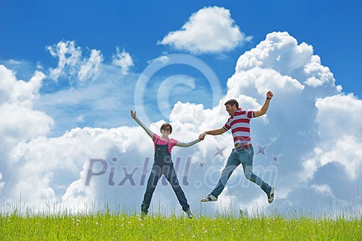 Portrait of romantic young couple in love smiling together outdoor in nature with blue sky in background Portrait of romantic young couple in love smiling together outdoor in nature with blue sky in background