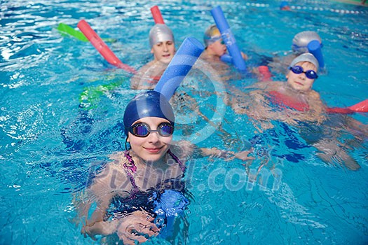 happy children kids group at swimming pool class learning to swim happy children kids group at swimming pool class learning to swim