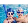 happy children kids group  at swimming pool class  learning to swim