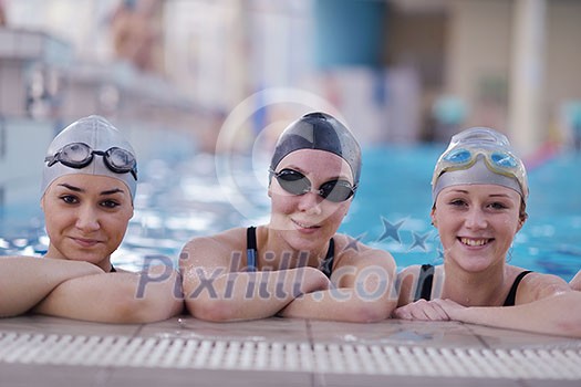 happy children kids group at swimming pool class learning to swim happy children kids group at swimming pool class learning to swim