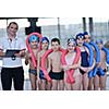 happy children kids group  at swimming pool class  learning to swim