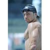 young healthy with muscular body man swim on swimming pool and representing healthy and recreation concept