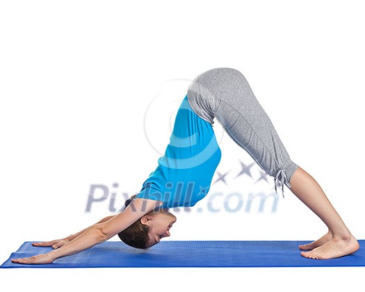 Yoga - young beautiful woman yoga instructor doing downward facing dog pose (adho mukha svanasana) exercise isolated on white background Yoga - young beautiful woman yoga instructor doing downward facing dog pose (adho mukha svanasana) exercise isolated on white background