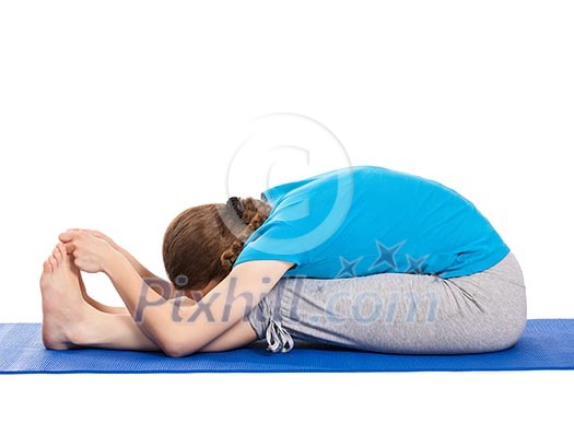 Yoga - young beautiful slender woman yoga instructor doing Seated Forward Bend or Intense Dorsal Stretch pose asana (Paschimottanasana) exercise isolated on white background Yoga - young beautiful slender woman yoga instructor doing Seated Forward Bend or Intense Dorsal Stretch pose asana (Paschimottanasana) exercise isolated on white background