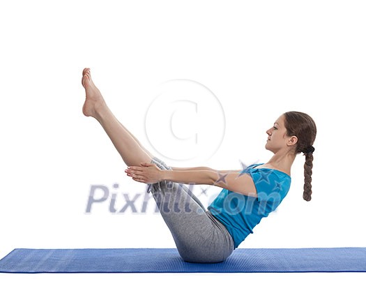 Yoga - young beautiful woman yoga instructor doing Full Boat pose asana (Paripurna navasana) exercise isolated on white background Yoga - young beautiful woman yoga instructor doing Full Boat pose asana (Paripurna navasana) exercise isolated on white background