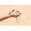 Sand running through hands